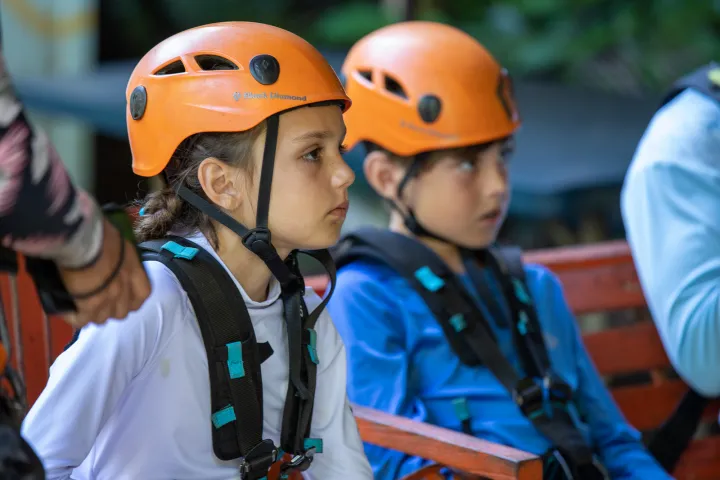 two kids in zipline gear