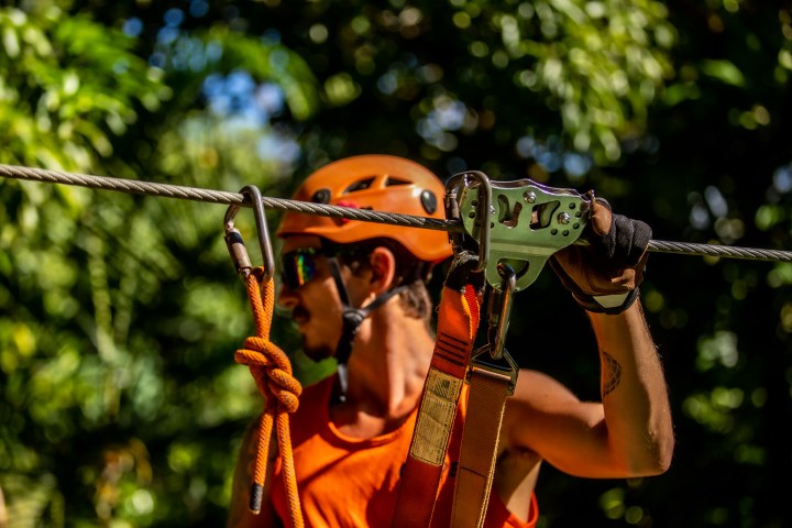 man holding zipline line