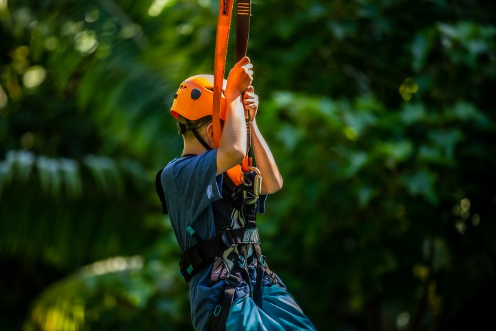 side view kid ziplining